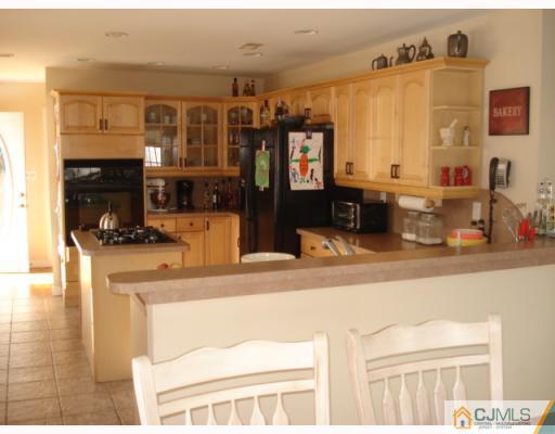 207 Princeton Road Old Bridge, NJ 08859 - Photo 4 of 10 a kitchen with a sink and cabinets