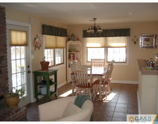 207 Princeton Road Old Bridge, NJ 08859 - Photo 5 of 10 a living room with furniture dining table and a large window