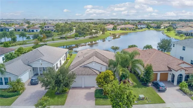 an aerial view of a house with a lake view