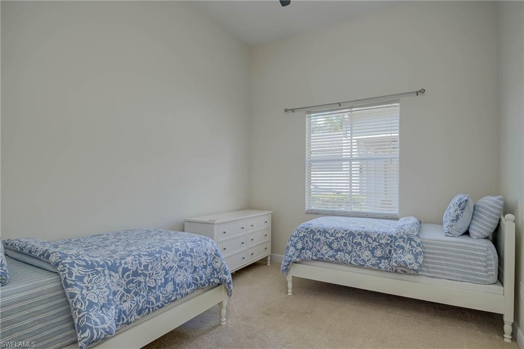 5254 Messina Street Ave Maria, FL 34142 - Photo 24 of 32 a bedroom with a bed and a window in it