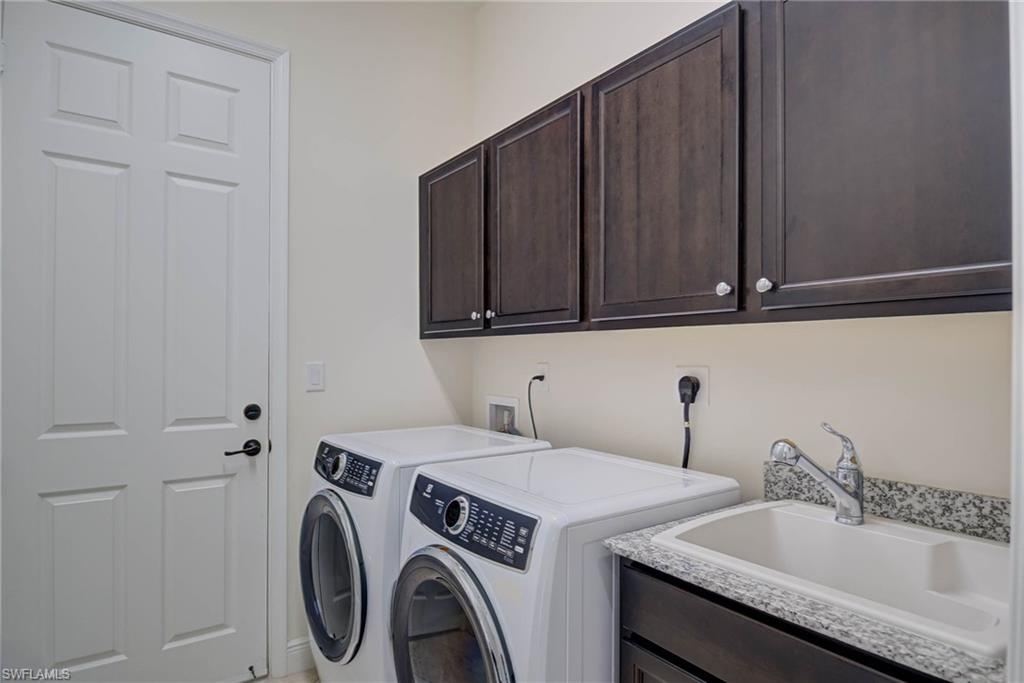 5254 Messina Street Ave Maria, FL 34142 - Photo 26 of 32 a utility room with dryer and washer