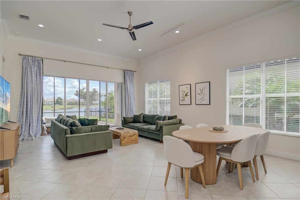 5254 Messina Street Ave Maria, FL 34142 - Photo 3 of 32 a living room with furniture and a large window