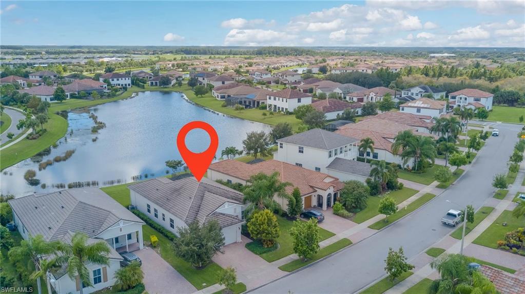5254 Messina Street Ave Maria, FL 34142 - Photo 32 of 32 an aerial view of swimming pool with a yard