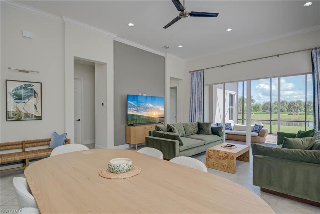5254 Messina Street Ave Maria, FL 34142 - Photo 4 of 32 a living room with furniture and a large window
