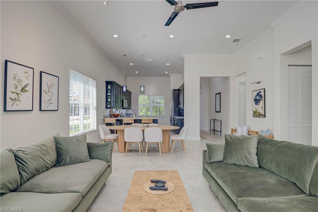 5254 Messina Street Ave Maria, FL 34142 - Photo 5 of 32 a living room with furniture and a large window