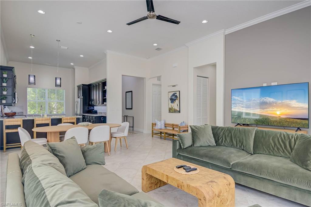 5254 Messina Street Ave Maria, FL 34142 - Photo 7 of 32 a living room with furniture and a large window