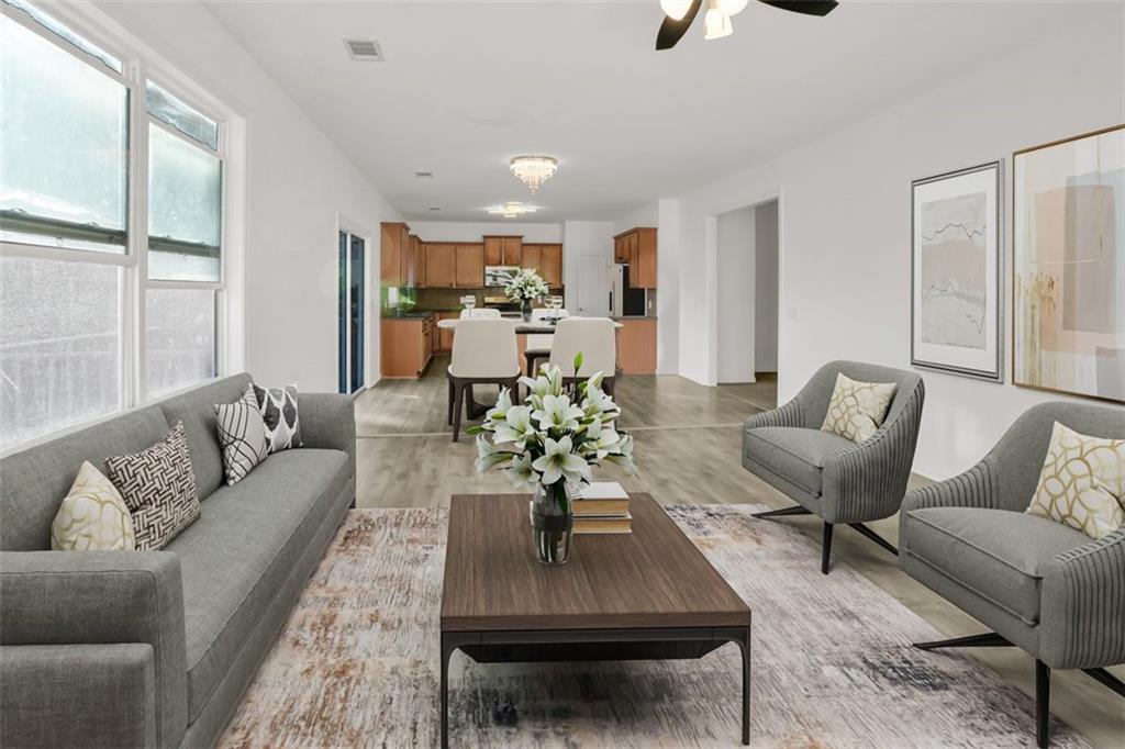 5280 Lakerock Way Southwest Atlanta, GA 30331 - Photo 12 of 33 a living room with furniture kitchen view and a window