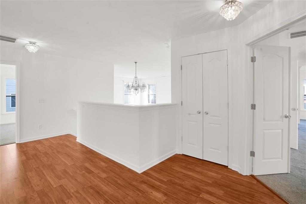 5280 Lakerock Way Southwest Atlanta, GA 30331 - Photo 16 of 33 a view of empty room with wooden floor and fan