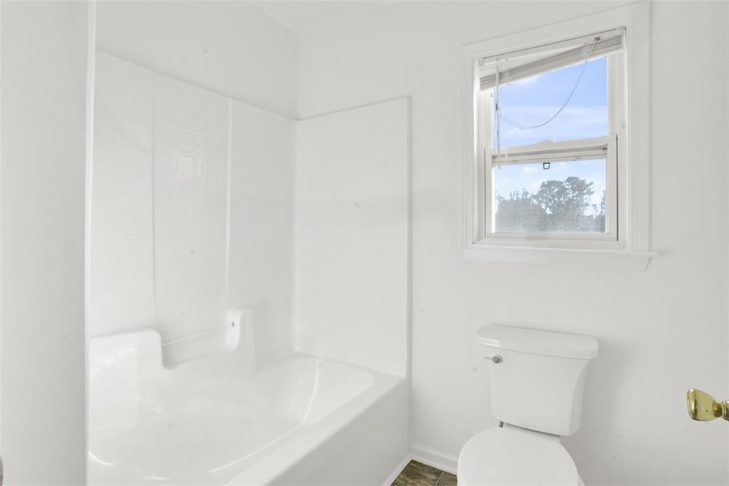 5280 Lakerock Way Southwest Atlanta, GA 30331 - Photo 20 of 33 a white toilet sitting next to a bathroom sink