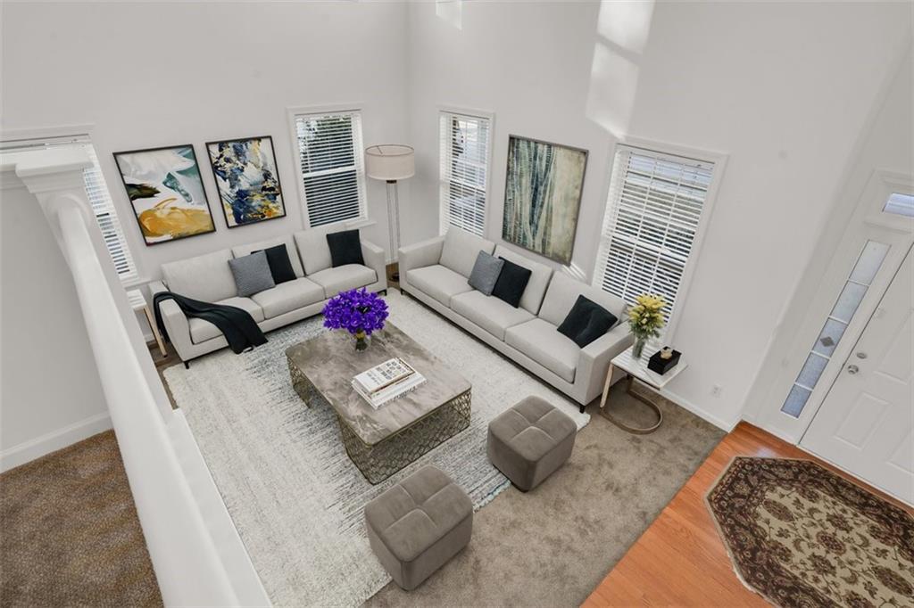5280 Lakerock Way Southwest Atlanta, GA 30331 - Photo 2 of 33 a living room with furniture rug and a table