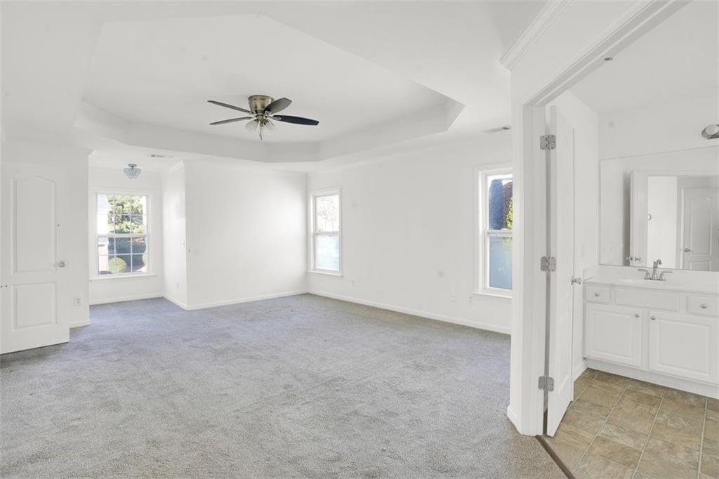 5280 Lakerock Way Southwest Atlanta, GA 30331 - Photo 22 of 33 wooden floor in an empty room with a window