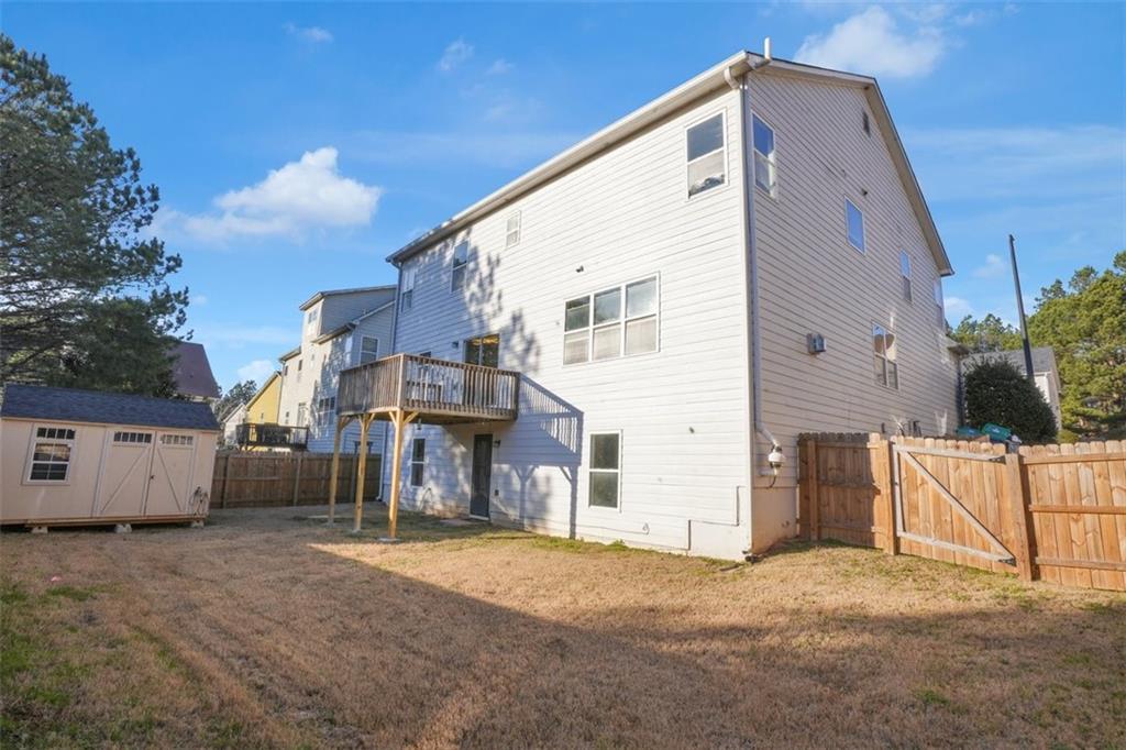 5280 Lakerock Way Southwest Atlanta, GA 30331 - Photo 32 of 33 a view of a house with a yard