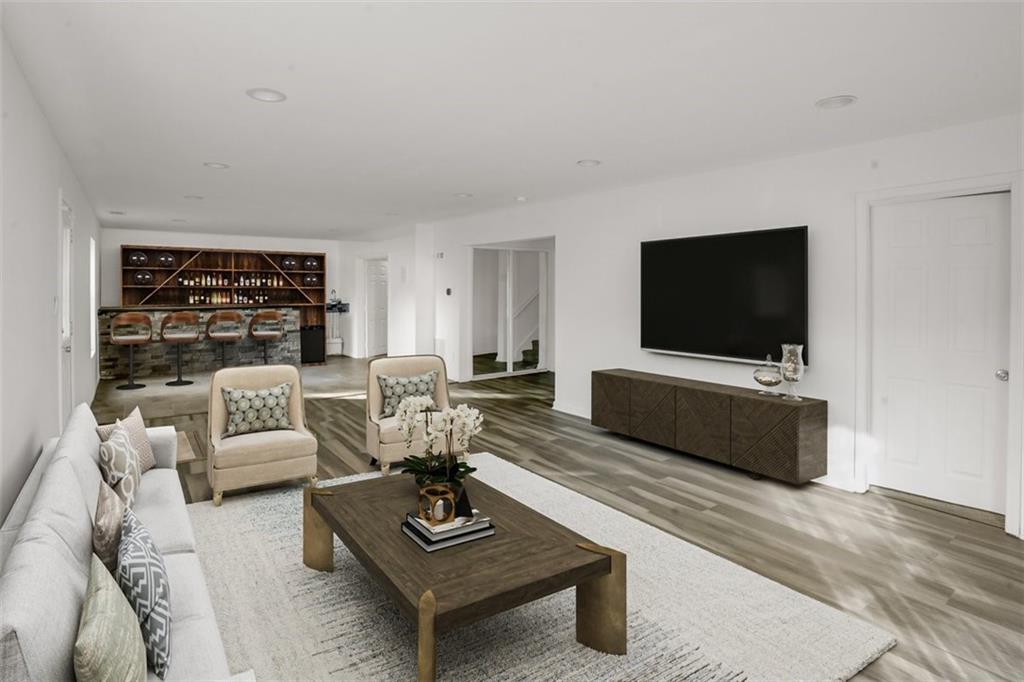 5280 Lakerock Way Southwest Atlanta, GA 30331 - Photo 5 of 33 a living room with furniture and a flat screen tv