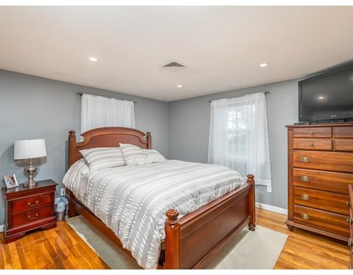21 Neck Road Rochester, MA 02770 - Photo 14 of 23 a spacious bedroom with a bed and a dresser