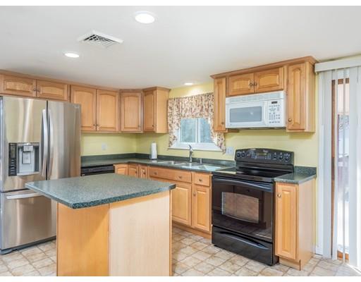 21 Neck Road Rochester, MA 02770 - Photo 6 of 23 a kitchen with stainless steel appliances granite countertop a stove a sink and a microwave