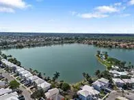 a view of a house with a yard and sitting area
