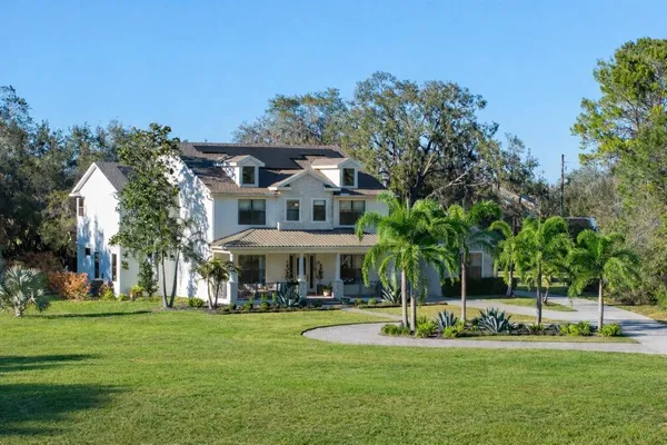 a view of a house with a big yard