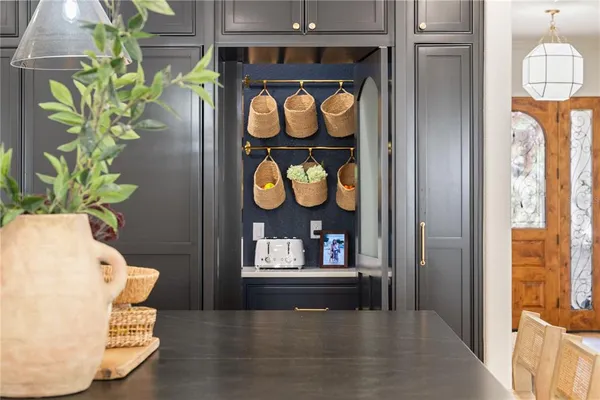 a large kitchen with a table and chairs in it