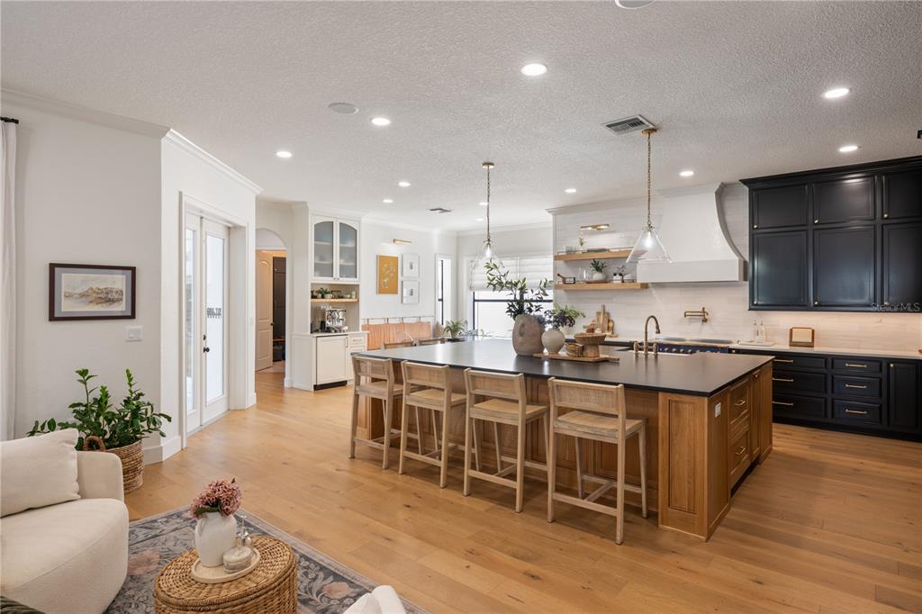 5351 Carson Street St. Cloud, FL 34771 - Photo 14 of 54 a large kitchen with a table and chairs in it