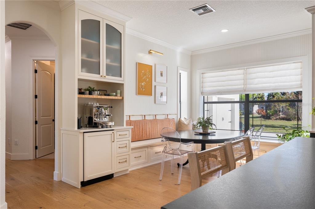 5351 Carson Street St. Cloud, FL 34771 - Photo 15 of 54 a dining room with stainless steel appliances kitchen island granite countertop a table and chairs in it