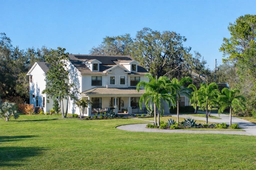 5351 Carson Street St. Cloud, FL 34771 - Photo 2 of 54 a view of a house with a big yard