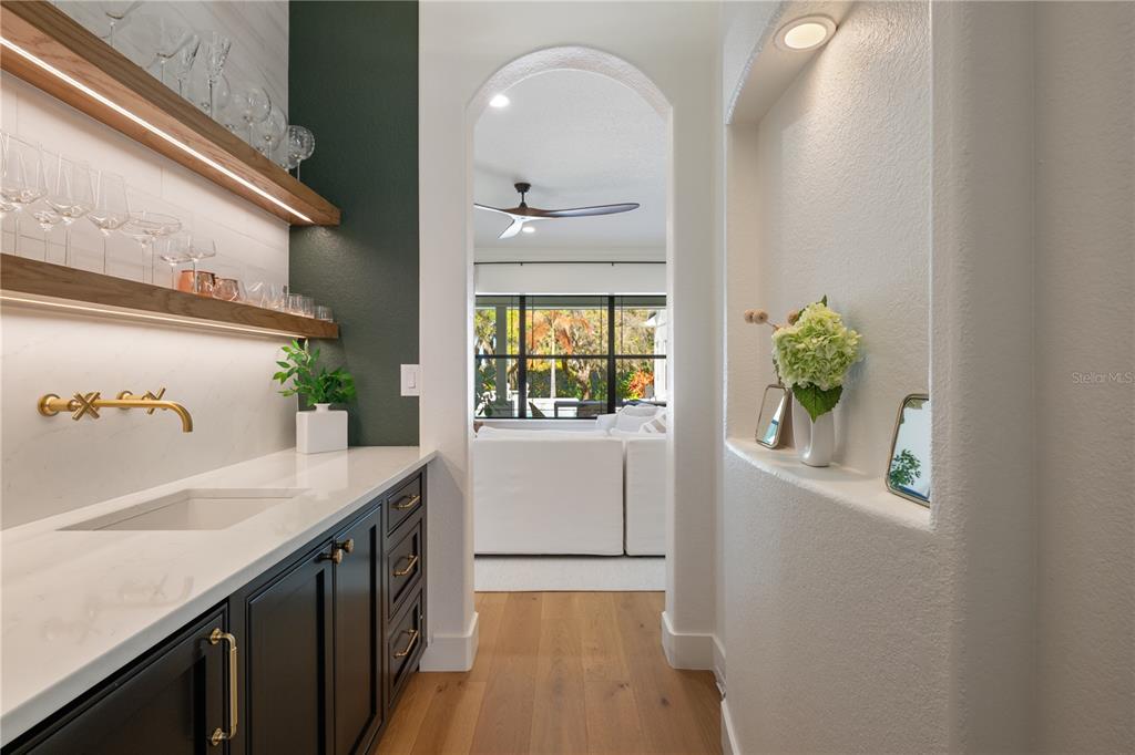 5351 Carson Street St. Cloud, FL 34771 - Photo 21 of 54 a bathroom with a granite countertop sink a window and a mirror