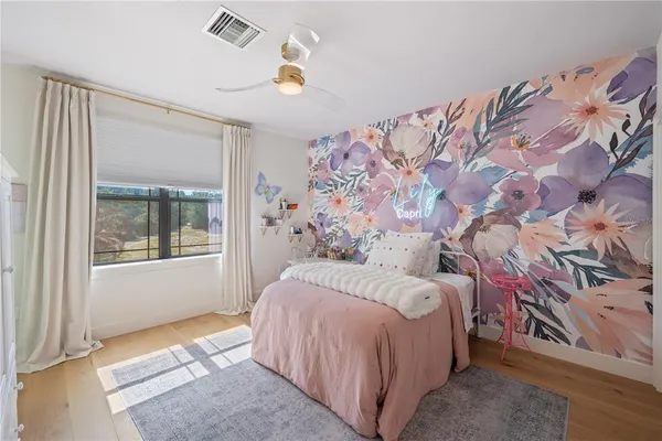 a bathroom with a granite countertop sink a mirror and a window