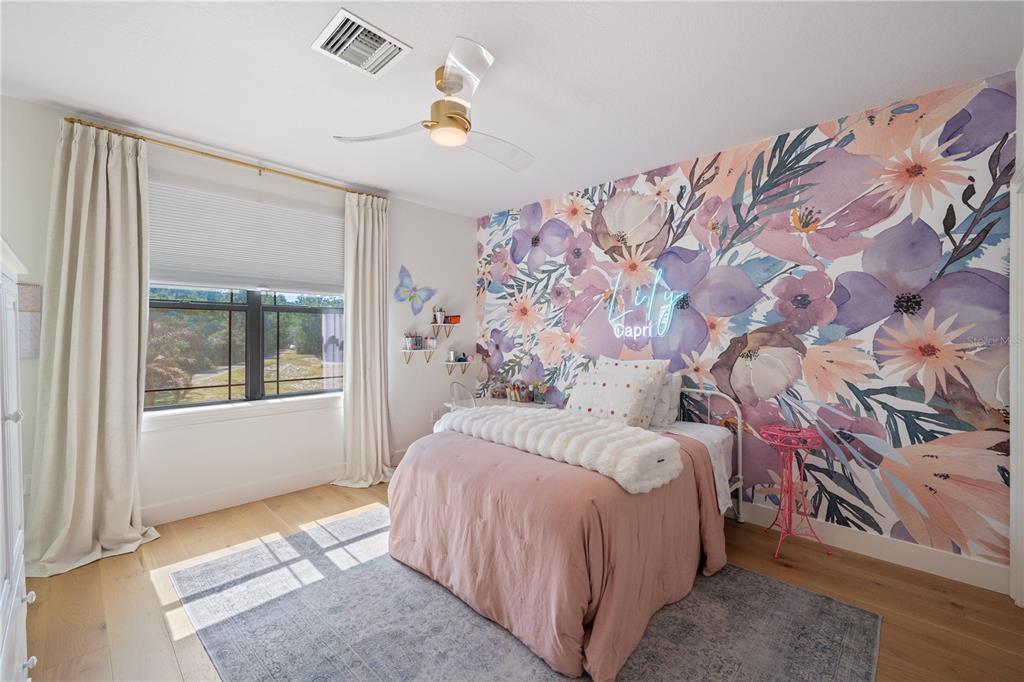 5351 Carson Street St. Cloud, FL 34771 - Photo 28 of 54 a bedroom with a bed and a window