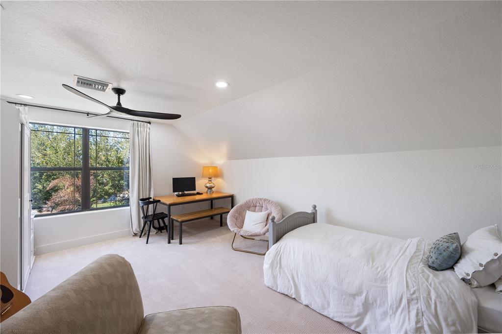 5351 Carson Street St. Cloud, FL 34771 - Photo 34 of 54 a bedroom with furniture and a large window