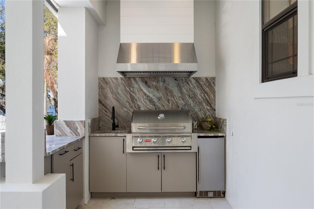 5351 Carson Street St. Cloud, FL 34771 - Photo 36 of 54 a stove top oven sitting inside of a kitchen