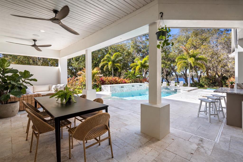 5351 Carson Street St. Cloud, FL 34771 - Photo 36 of 54 a outdoor dining space with furniture and garden view