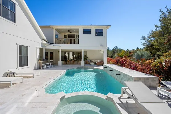 a view of a swimming pool with a patio