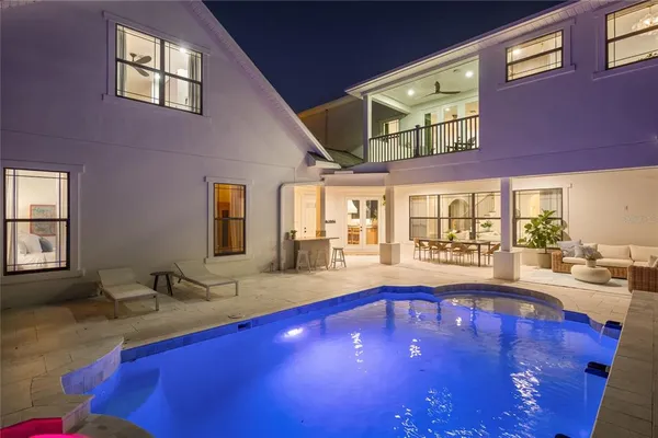 a view of outdoor space with swimming pool and trees