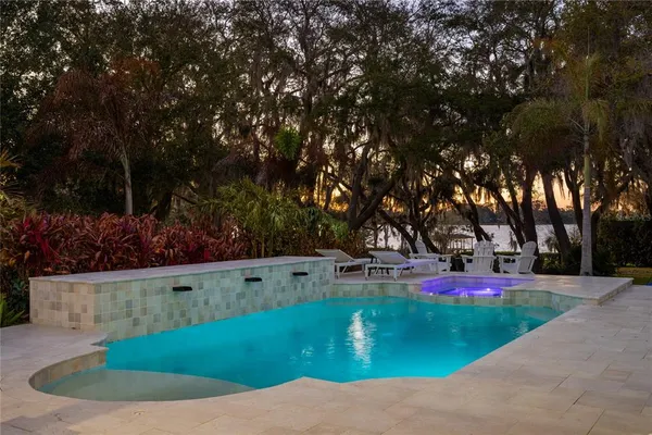 a view of a backyard with sitting area