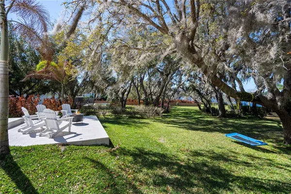 a backyard of a house with lots of green space