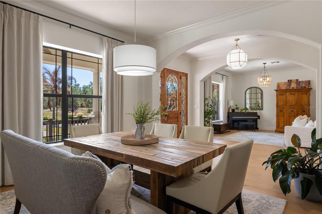5351 Carson Street St. Cloud, FL 34771 - Photo 8 of 54 a view of a dining room with furniture window and wooden floor