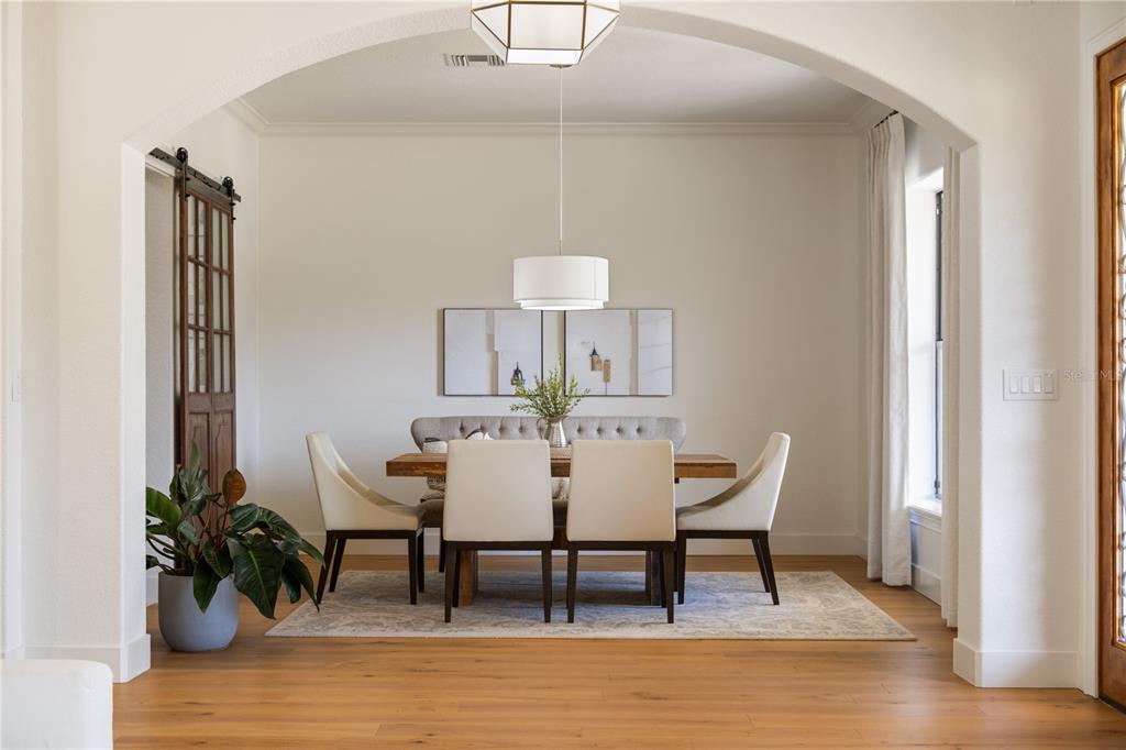 5351 Carson Street St. Cloud, FL 34771 - Photo 9 of 54 a view of a dining room with furniture and wooden floor