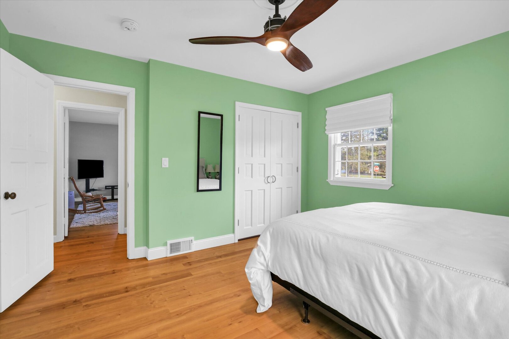 701 Hamilton Drive Champaign, IL 61820 - Photo 30 of 42 a bedroom with a bed and a chandelier