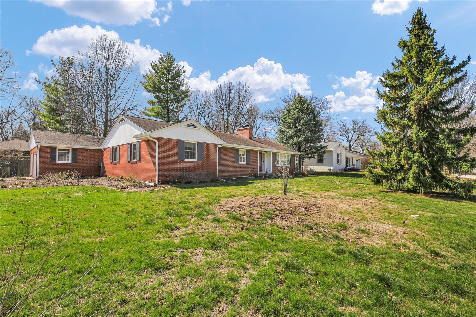 701 Hamilton Drive Champaign, IL 61820 - Photo 4 of 42 a view of a house with backyard and garden