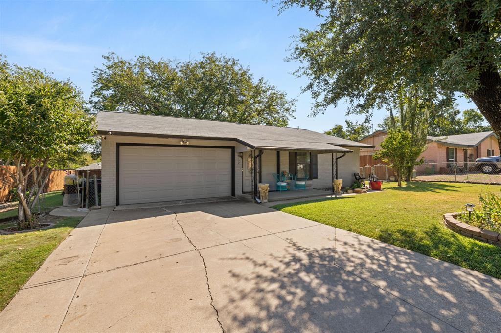 912 Crockett Street Midlothian, TX 76065 - Photo 28 of 29 a front view of a house with a yard and garage