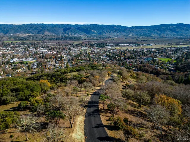 an aerial view of residential house and green space