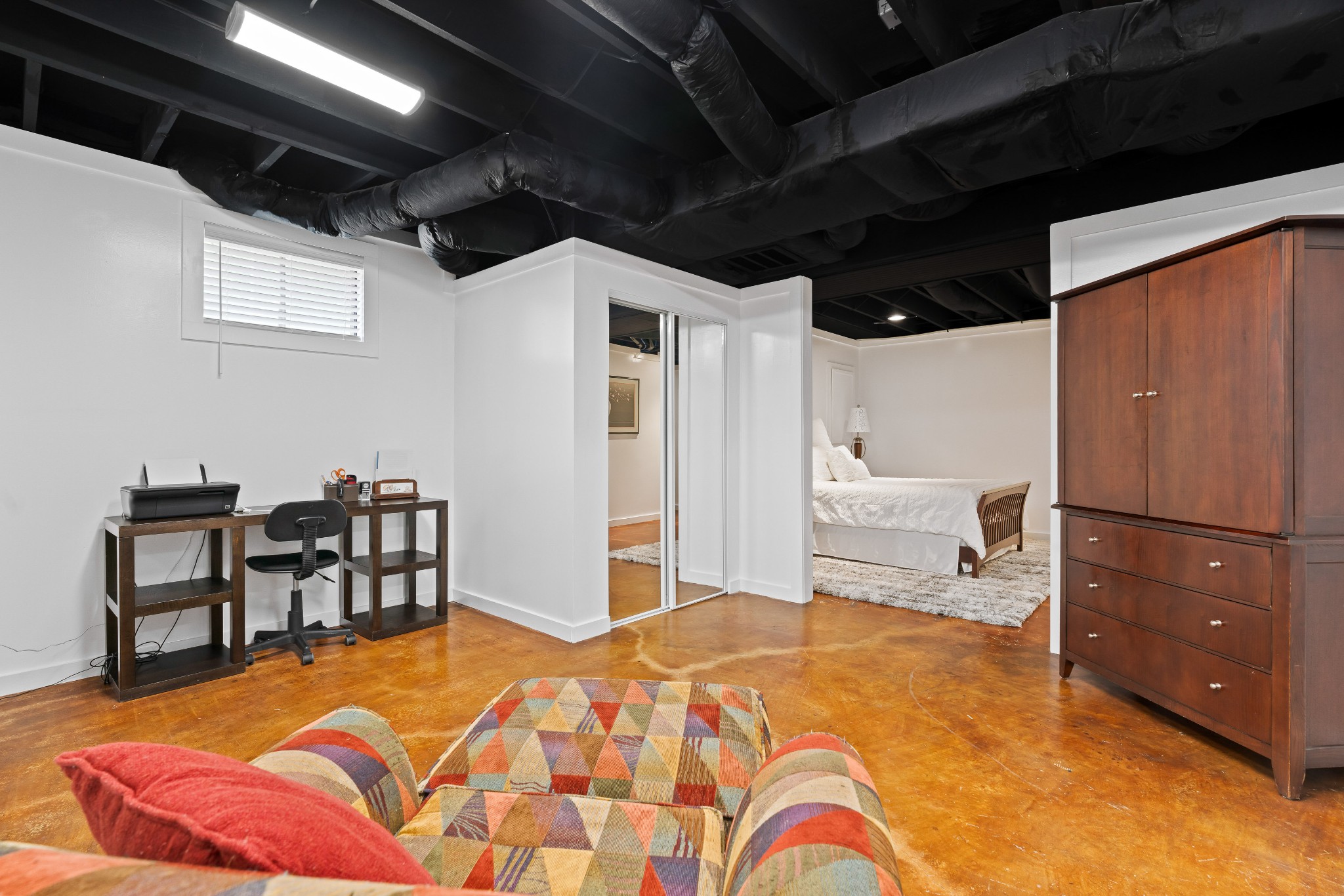 1708 Sugar Ridge Road Spring Hill, TN 37174 - Photo 38 of 70 a bedroom with a bed a table and a dresser