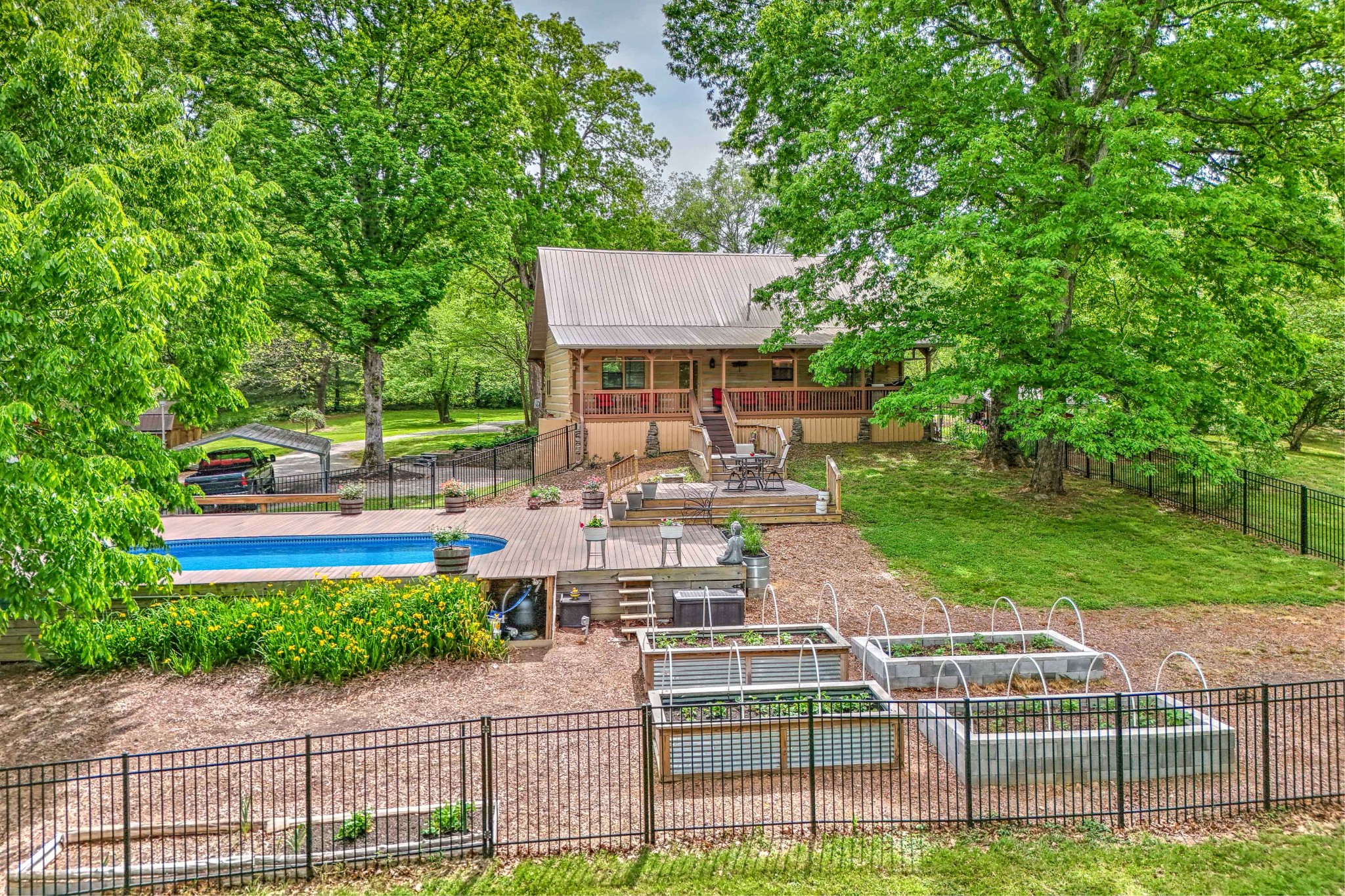 1708 Sugar Ridge Road Spring Hill, TN 37174 - Photo 49 of 70 a view of a patio with table and chairs and potted plants