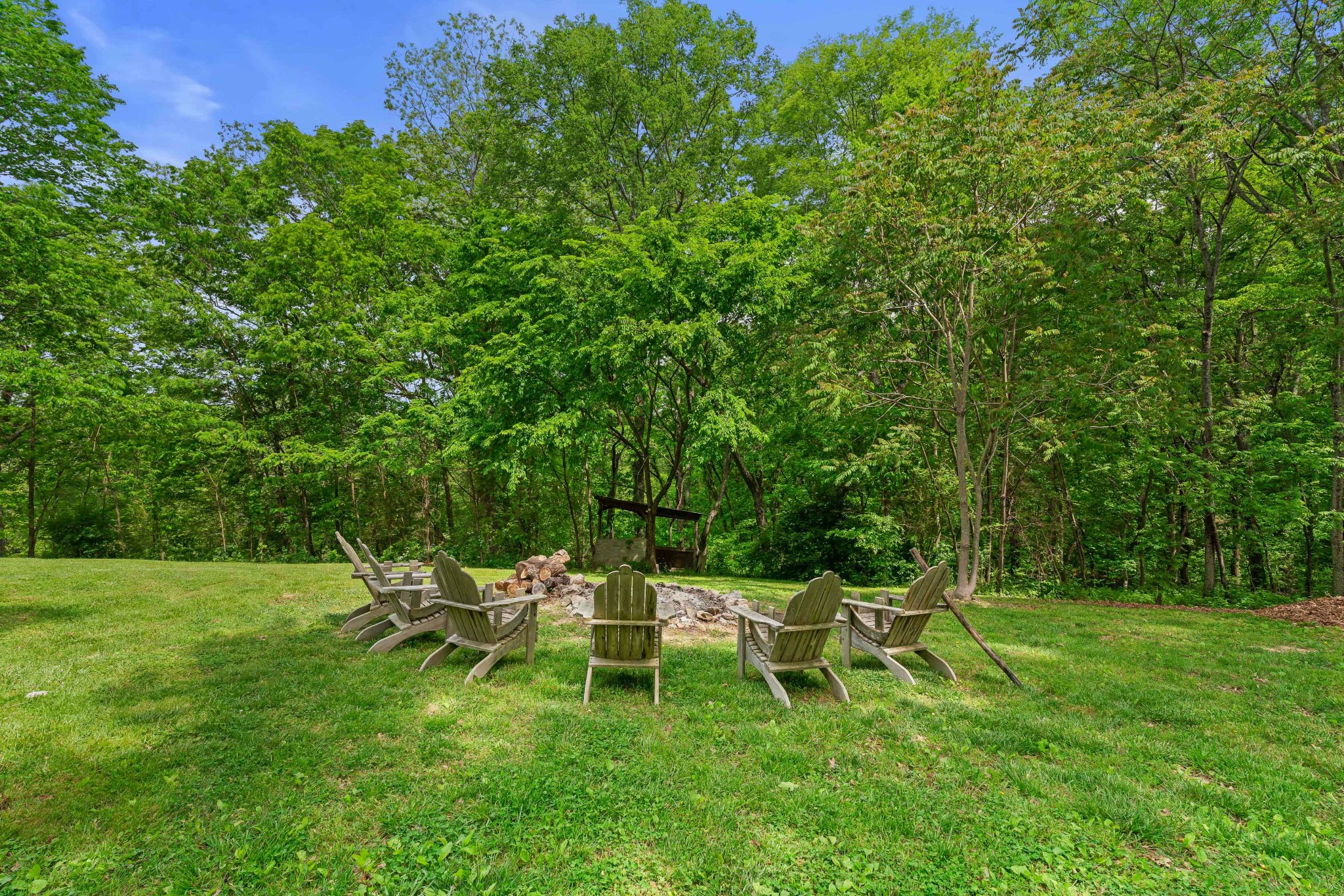 1708 Sugar Ridge Road Spring Hill, TN 37174 - Photo 51 of 70 a lawn chair and table sitting in big yard with lawn chairs
