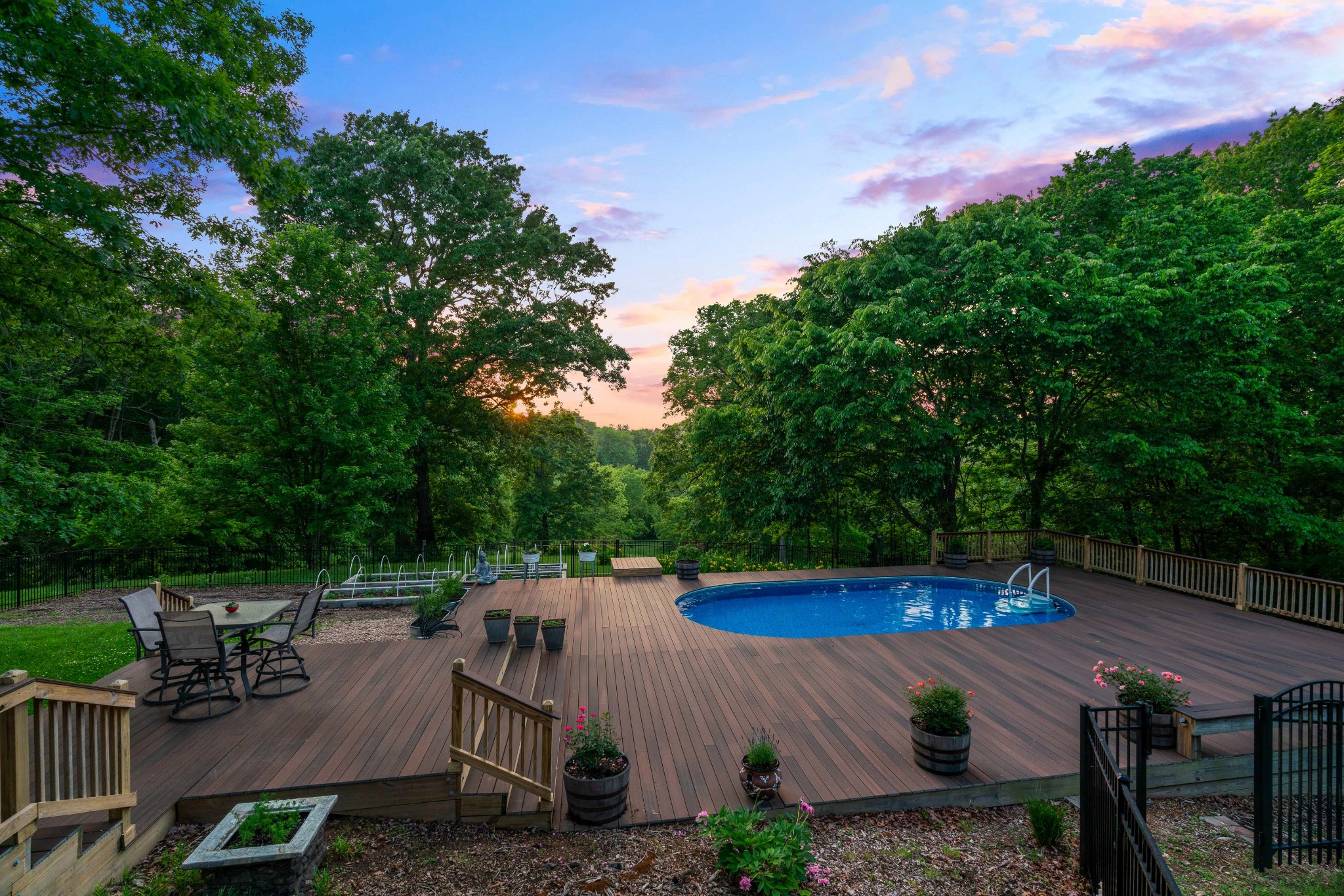 1708 Sugar Ridge Road Spring Hill, TN 37174 - Photo 60 of 70 a view of a patio with table and chairs potted plants with wooden floor and fence