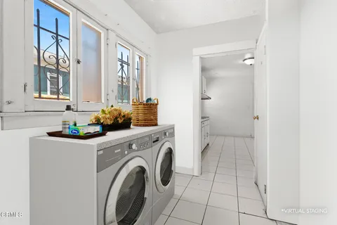 a view of a hallway with washer and dryer
