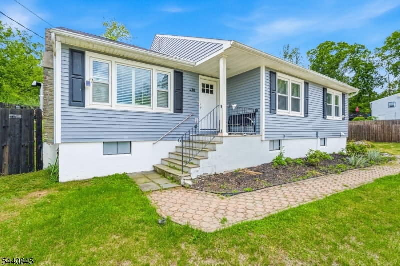 36 Forest Road Andover, NJ 07821 - Photo 6 of 50 a front view of a house with a yard and porch