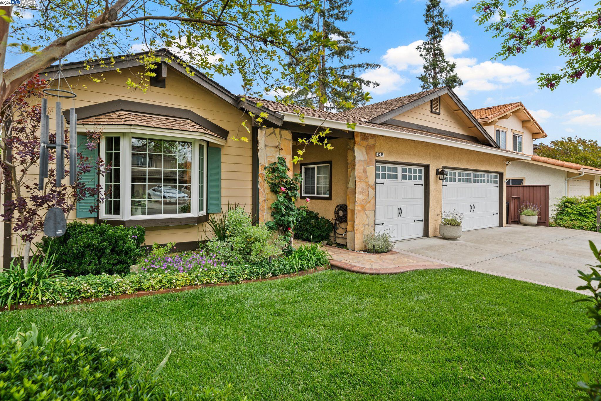 front view of a house with a yard
