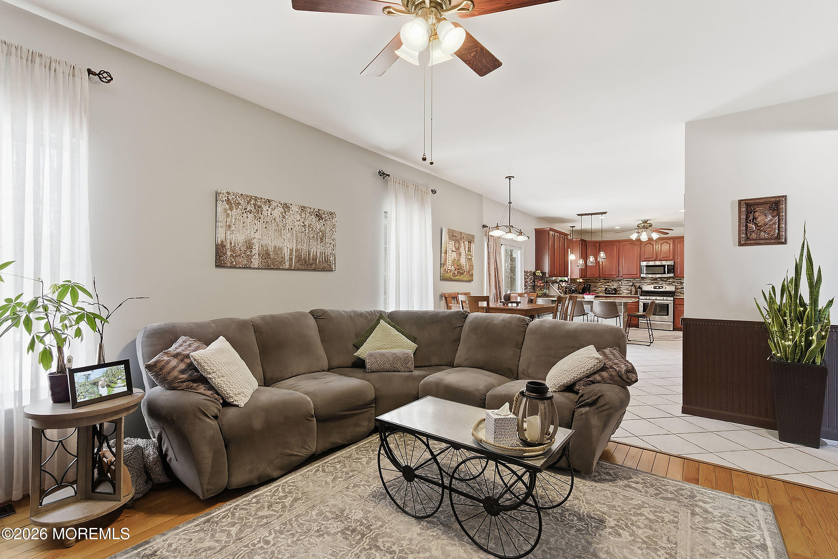 9 Kindling Way Jackson, NJ 08527 - Photo 17 of 33 a living room with furniture and a chandelier