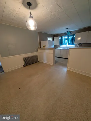 a view of a kitchen with a sink cabinets and window
